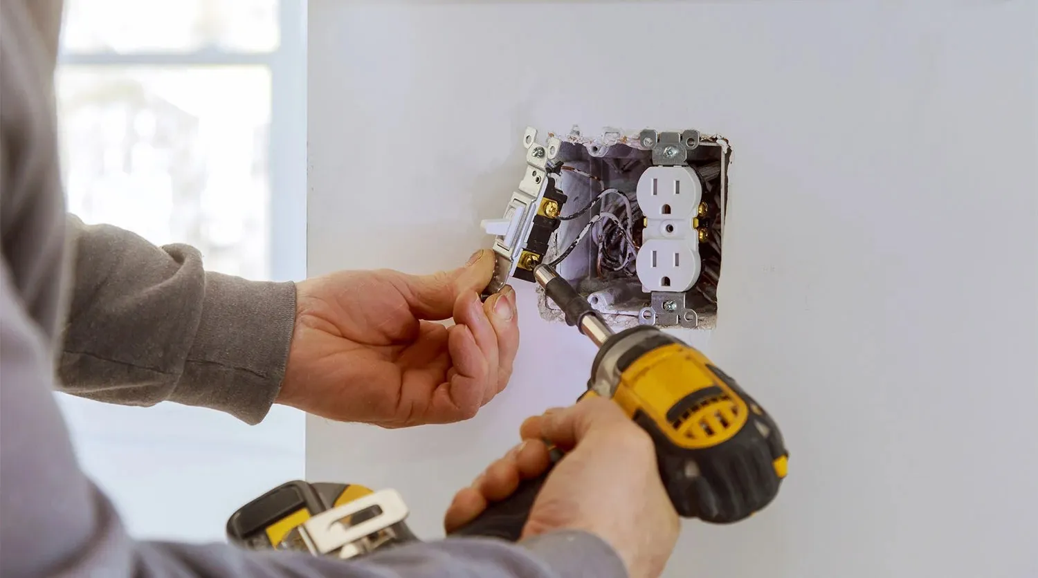 GFCI outlet installation in kitchen and bathrooms for enhanced safety