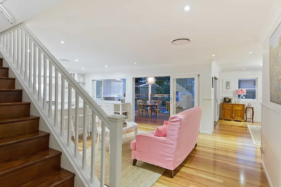Living room makeover with new flooring and contemporary lighting